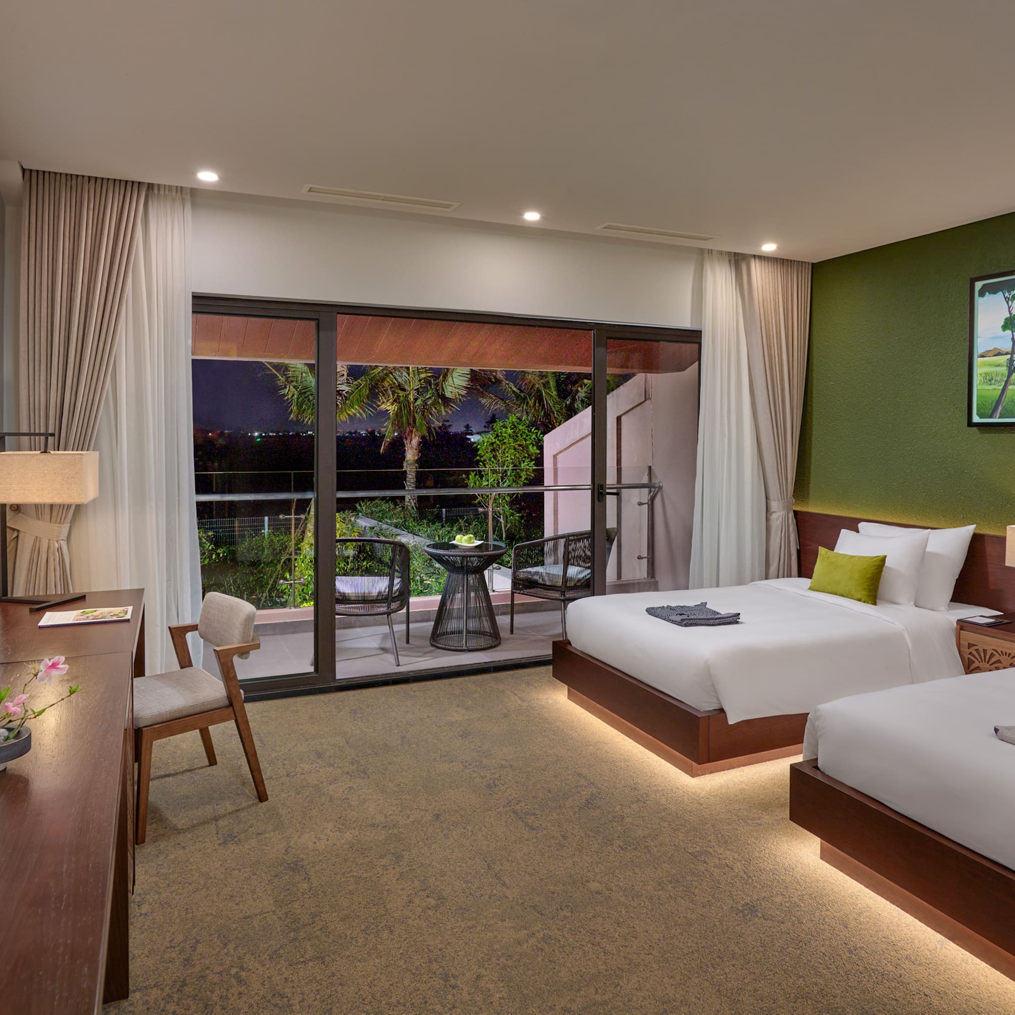 a room with two beds and a table