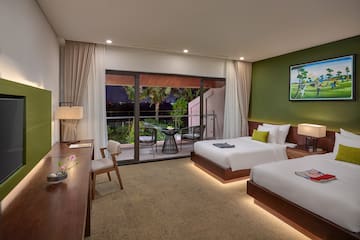 a room with two beds and a table