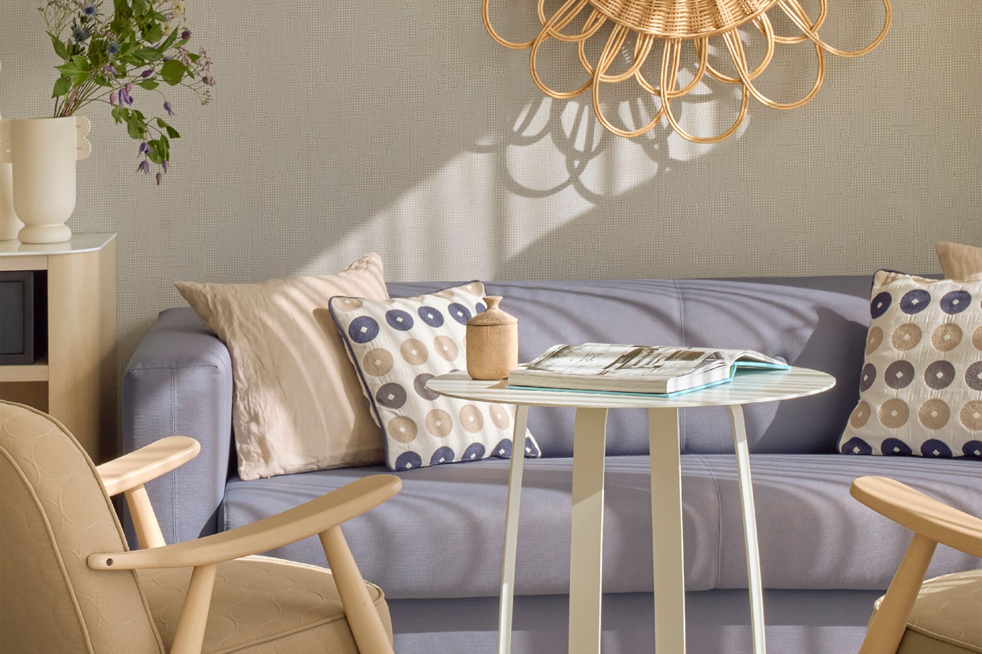 a living room with a couch and chairs