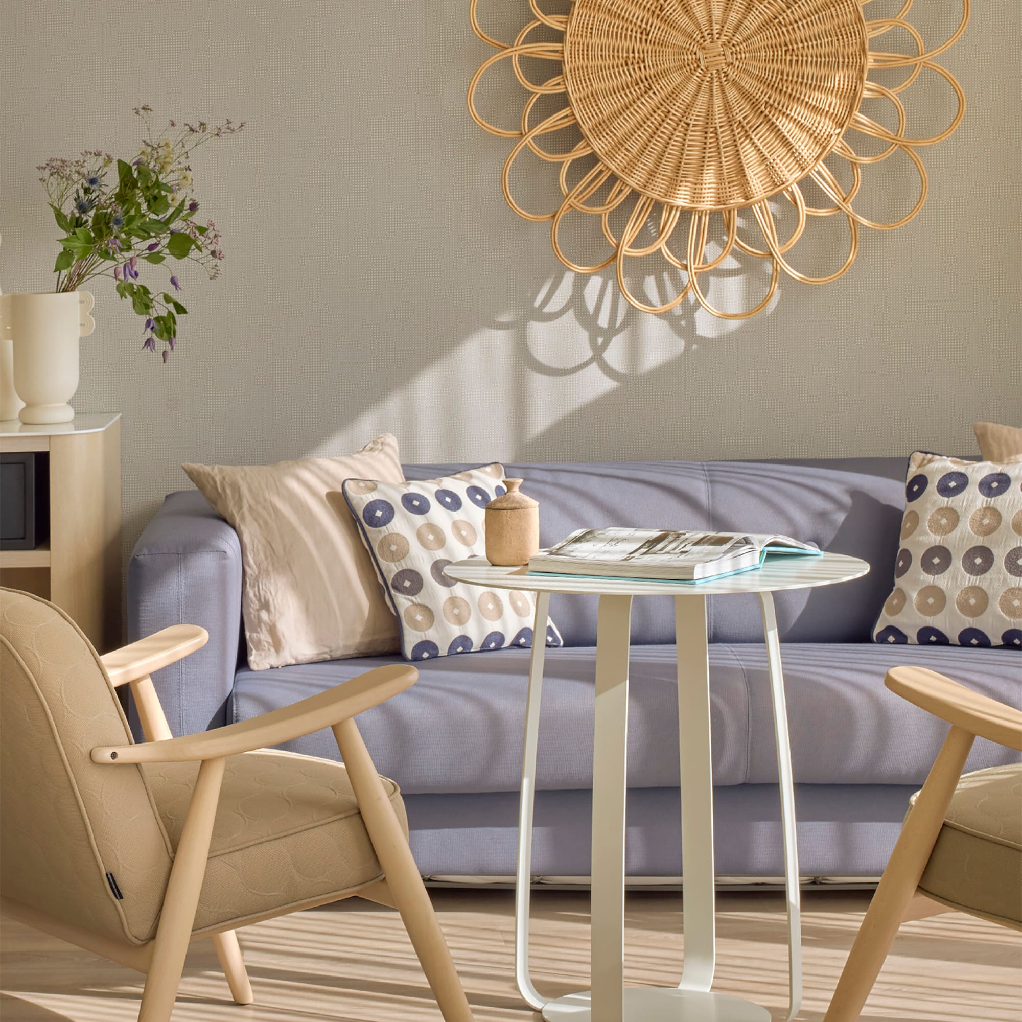 a living room with a couch and chairs