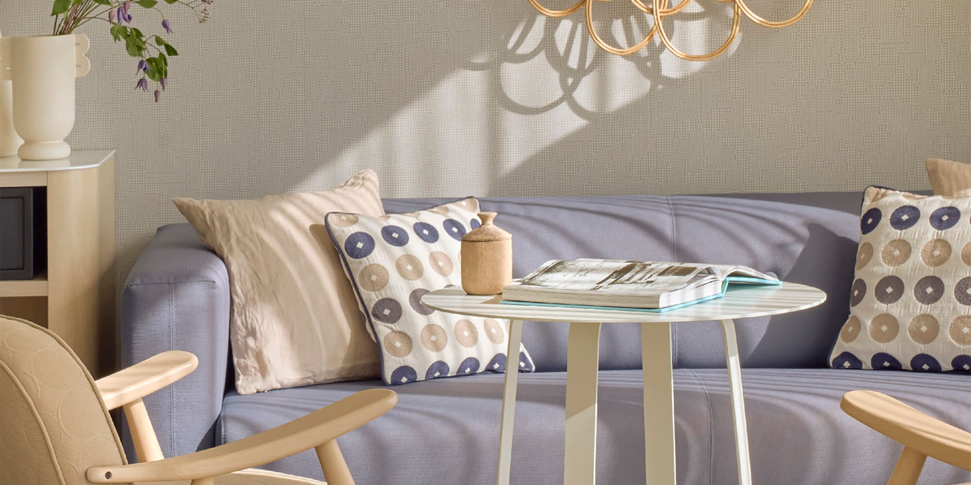 a living room with a couch and chairs