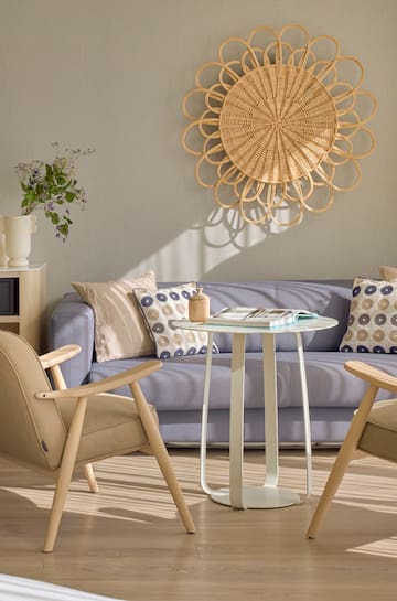 a living room with a couch and chairs