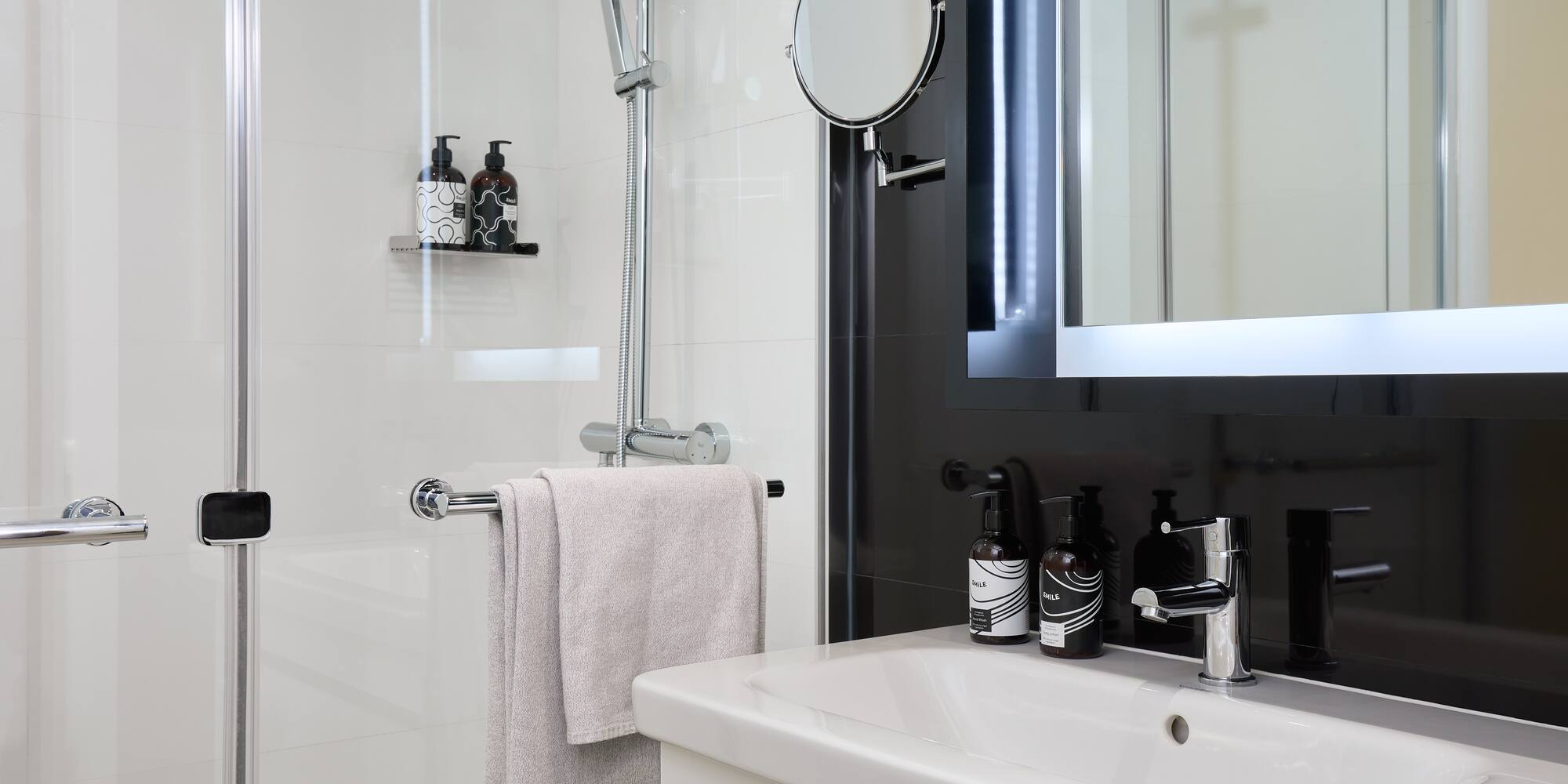 a bathroom with a mirror and a sink
