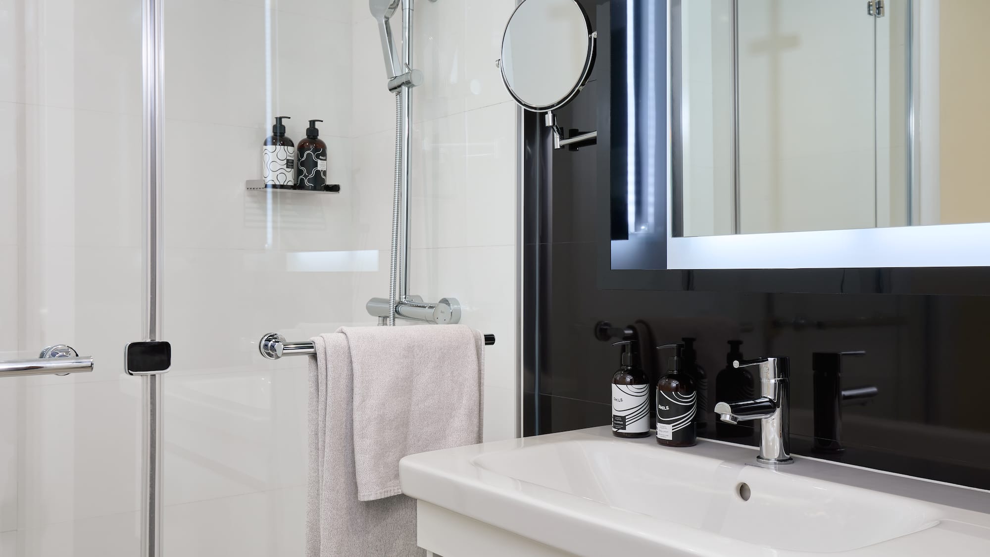 a bathroom with a mirror and a sink