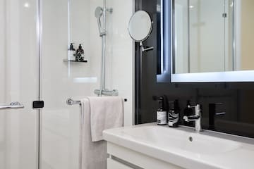 a bathroom with a mirror and a sink