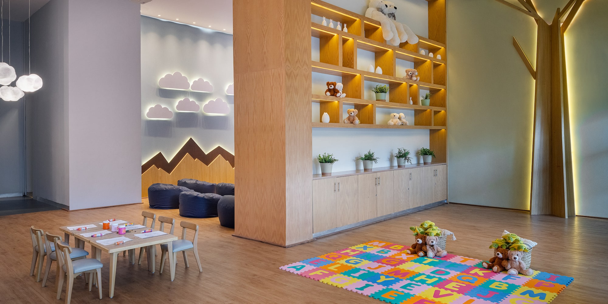 a room with a large wall and shelves