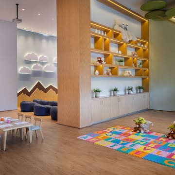 a room with a large wall and shelves