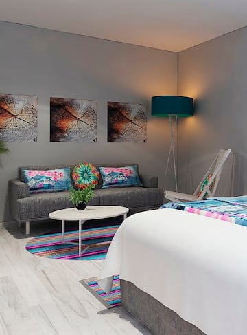 a room with a couch and a lamp