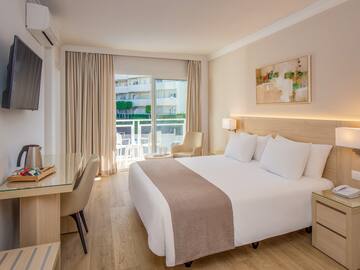 a room with a bed and a desk