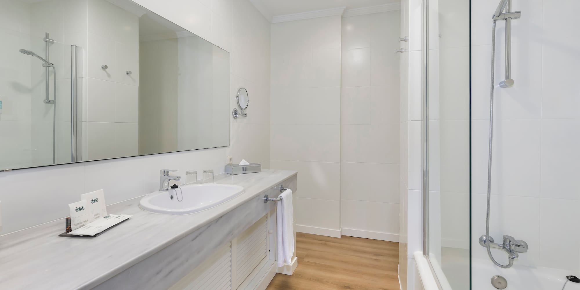 a bathroom with a sink and shower