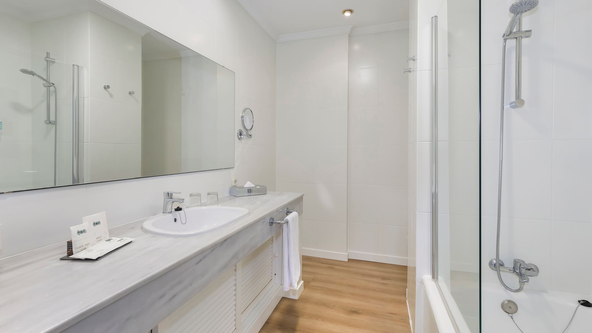 a bathroom with a sink and shower