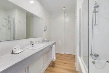 a bathroom with a sink and shower