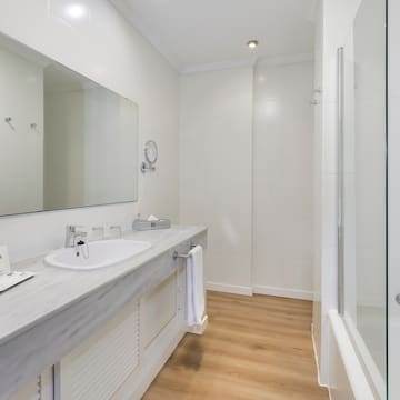 a bathroom with a sink and shower