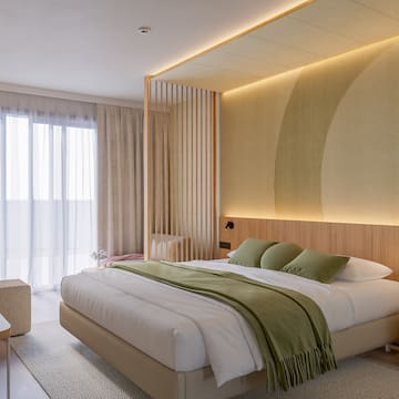 a bedroom with a bed and a wood wall