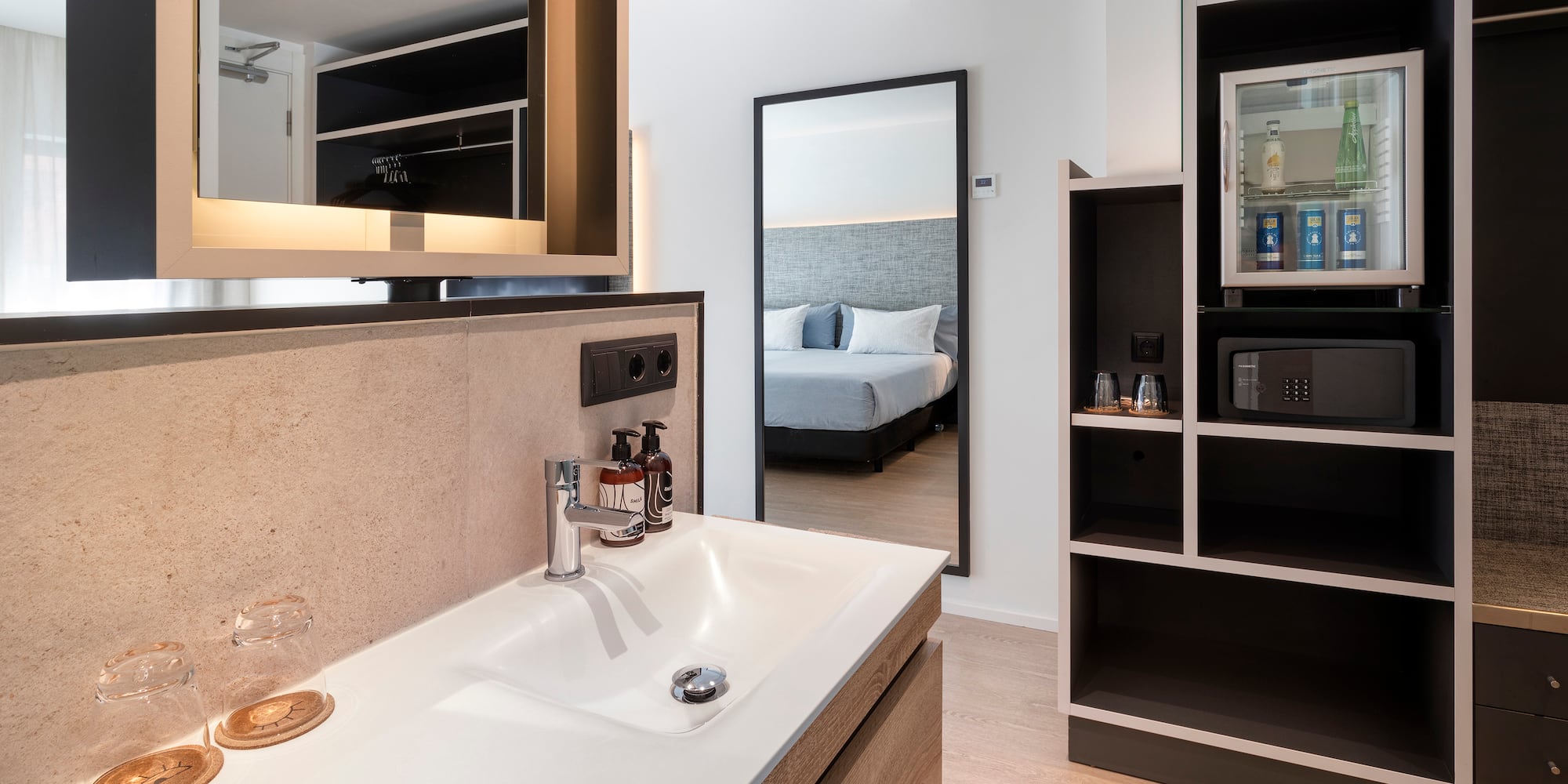 a bathroom with a mirror and a sink