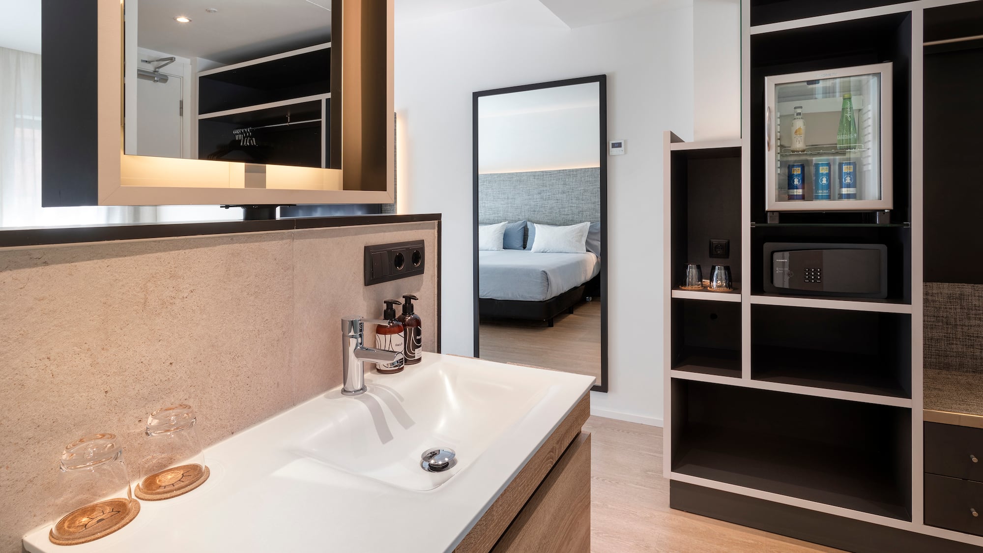 a bathroom with a mirror and a sink