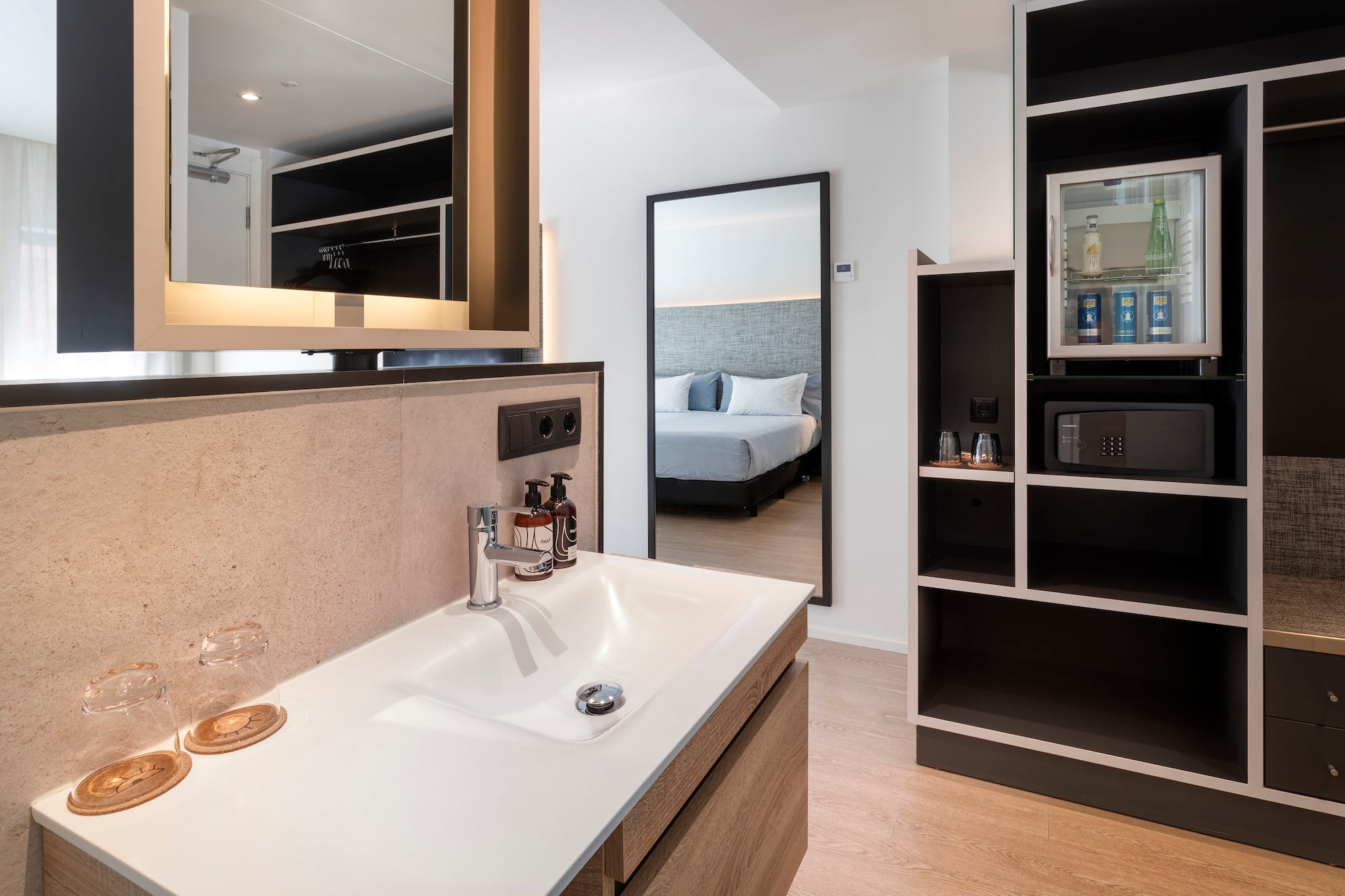 a bathroom with a mirror and a sink