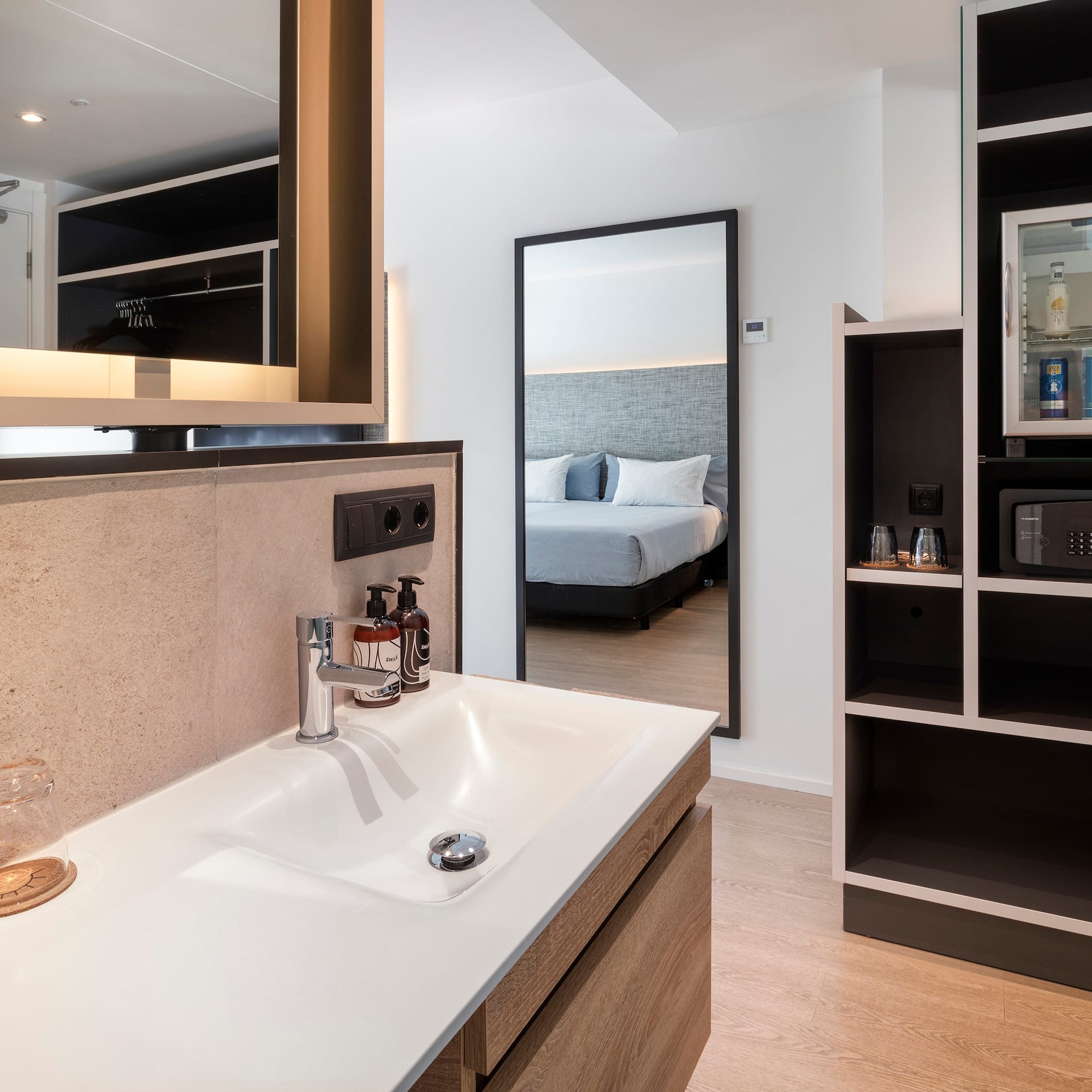 a bathroom with a mirror and a sink