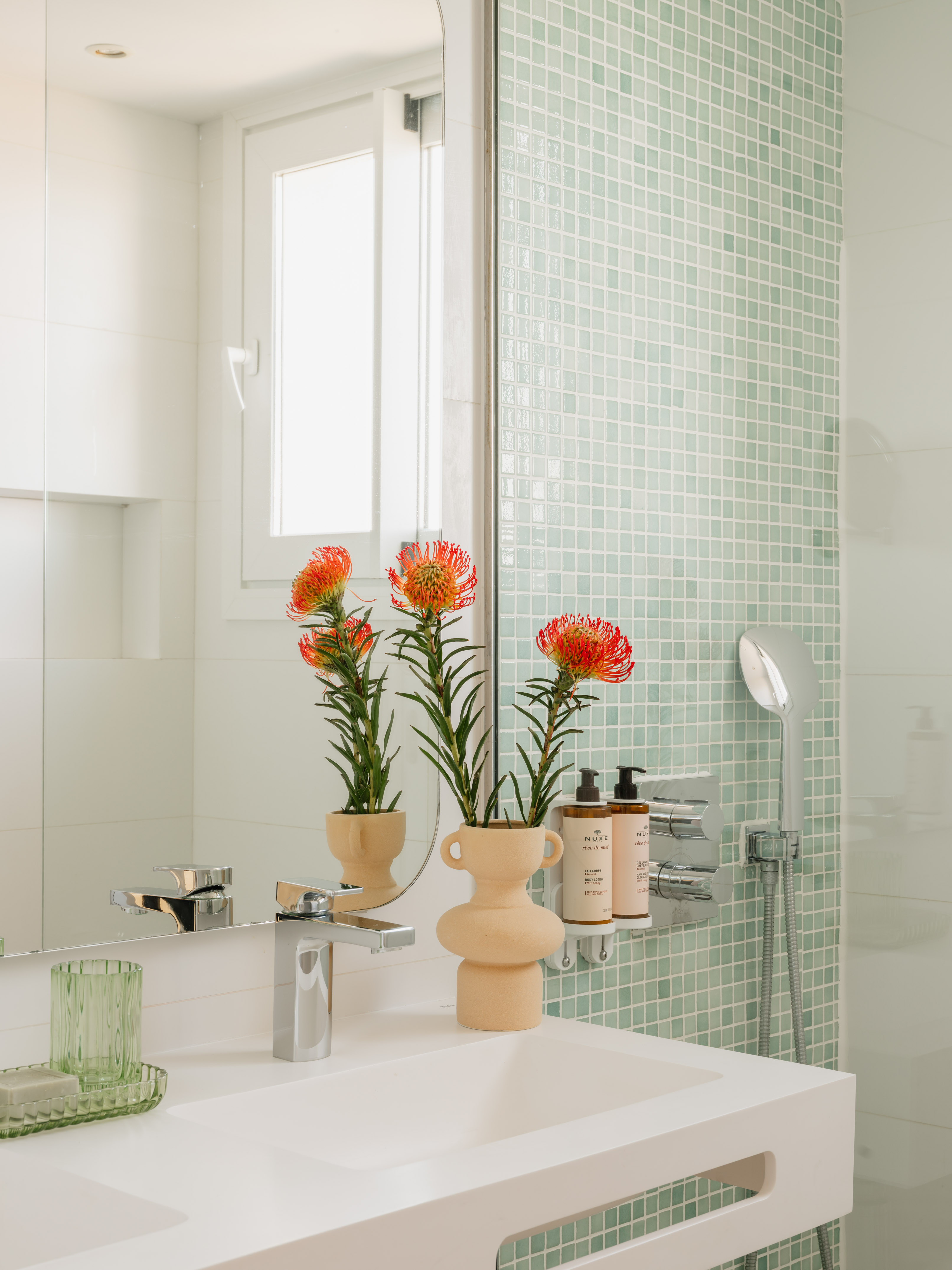 a bathroom with a sink and a mirror