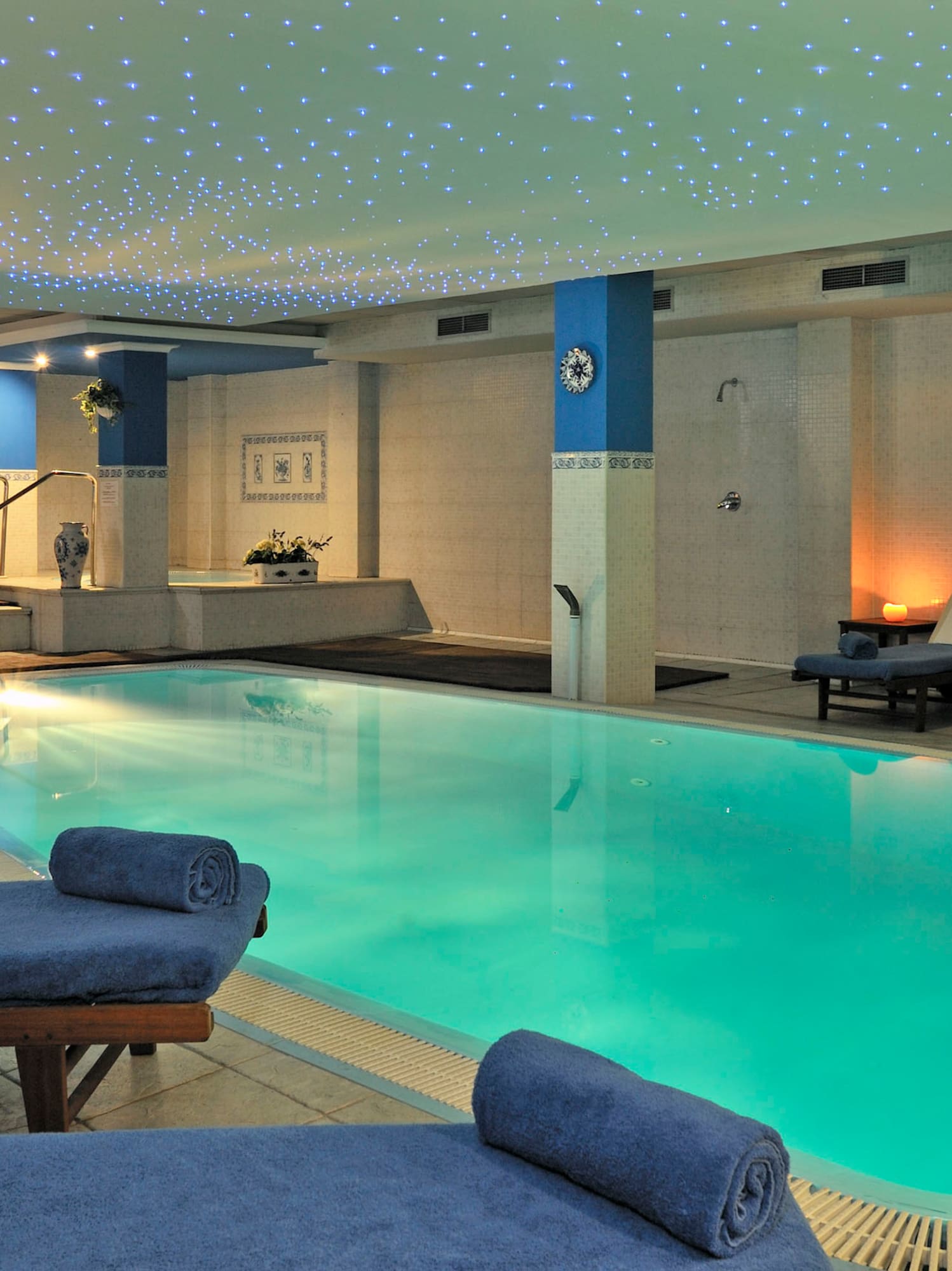 a pool with lounge chairs and a table