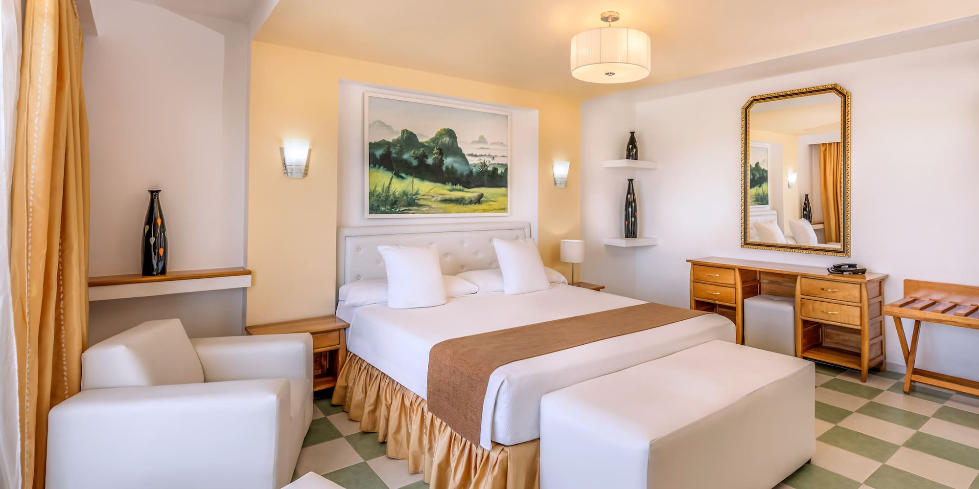 a bedroom with a bed and a mirror