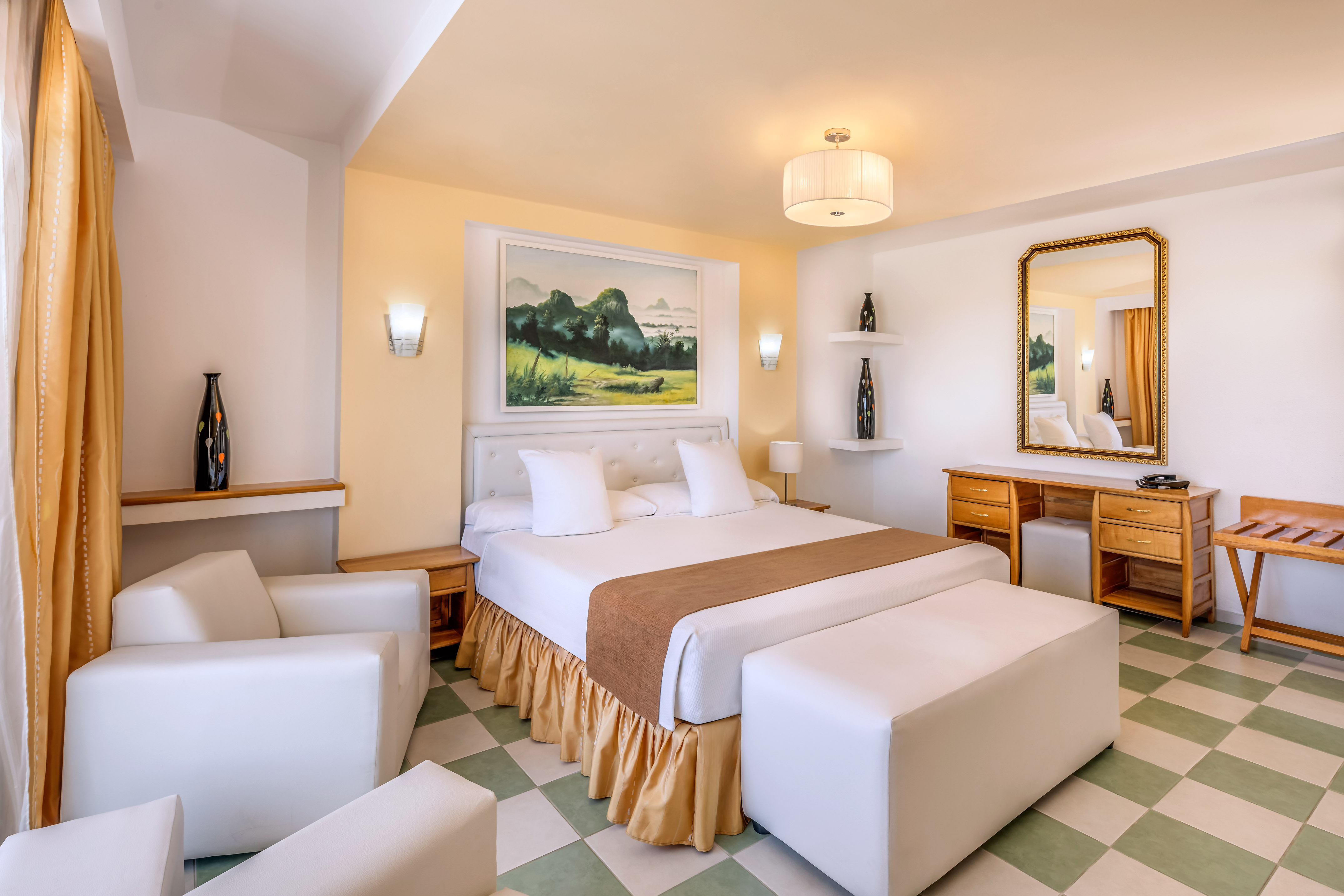 a bedroom with a bed and a mirror