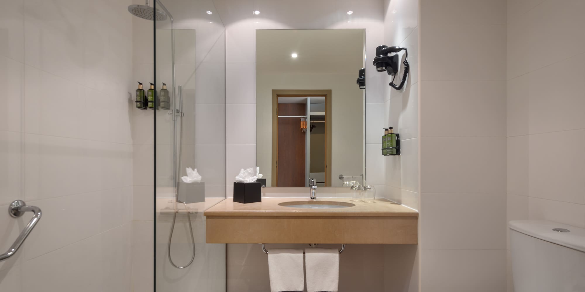 a bathroom with a sink and shower