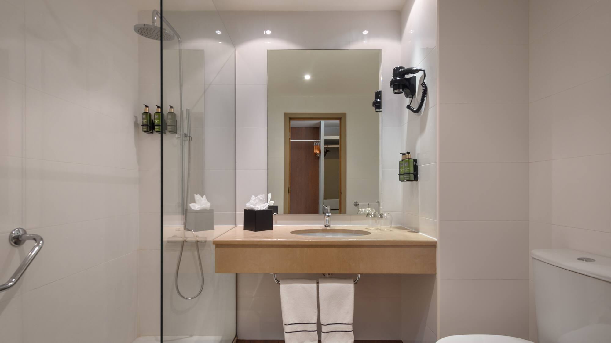 a bathroom with a sink and shower