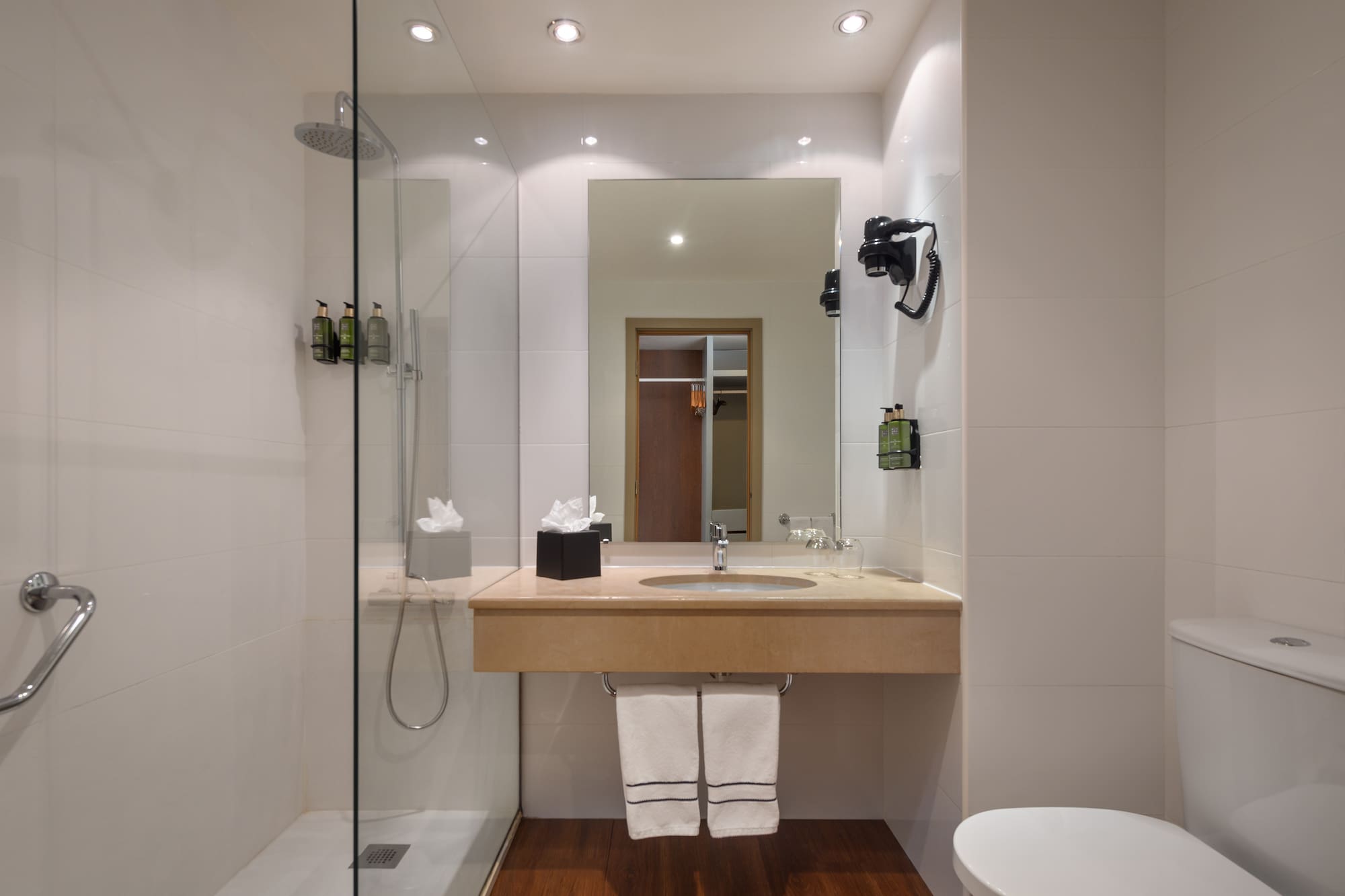 a bathroom with a sink and shower