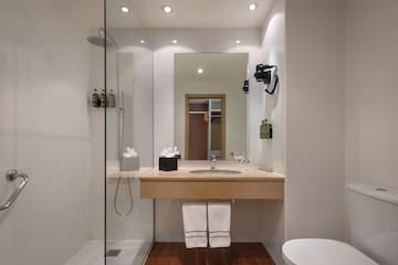 a bathroom with a sink and shower