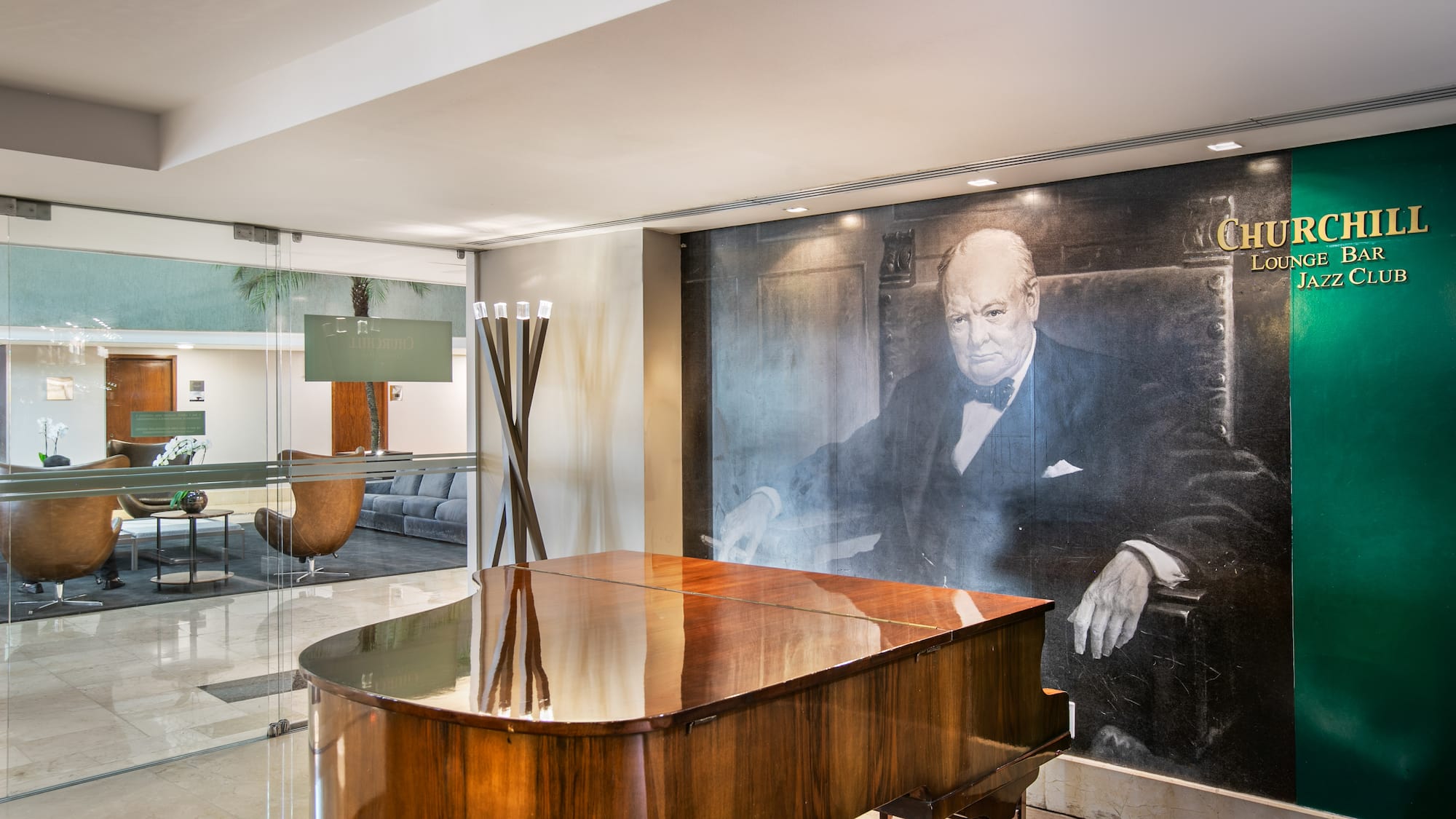 Grand piano, Winston Churchill mural in Churchill Lounge Bar Jazz Club