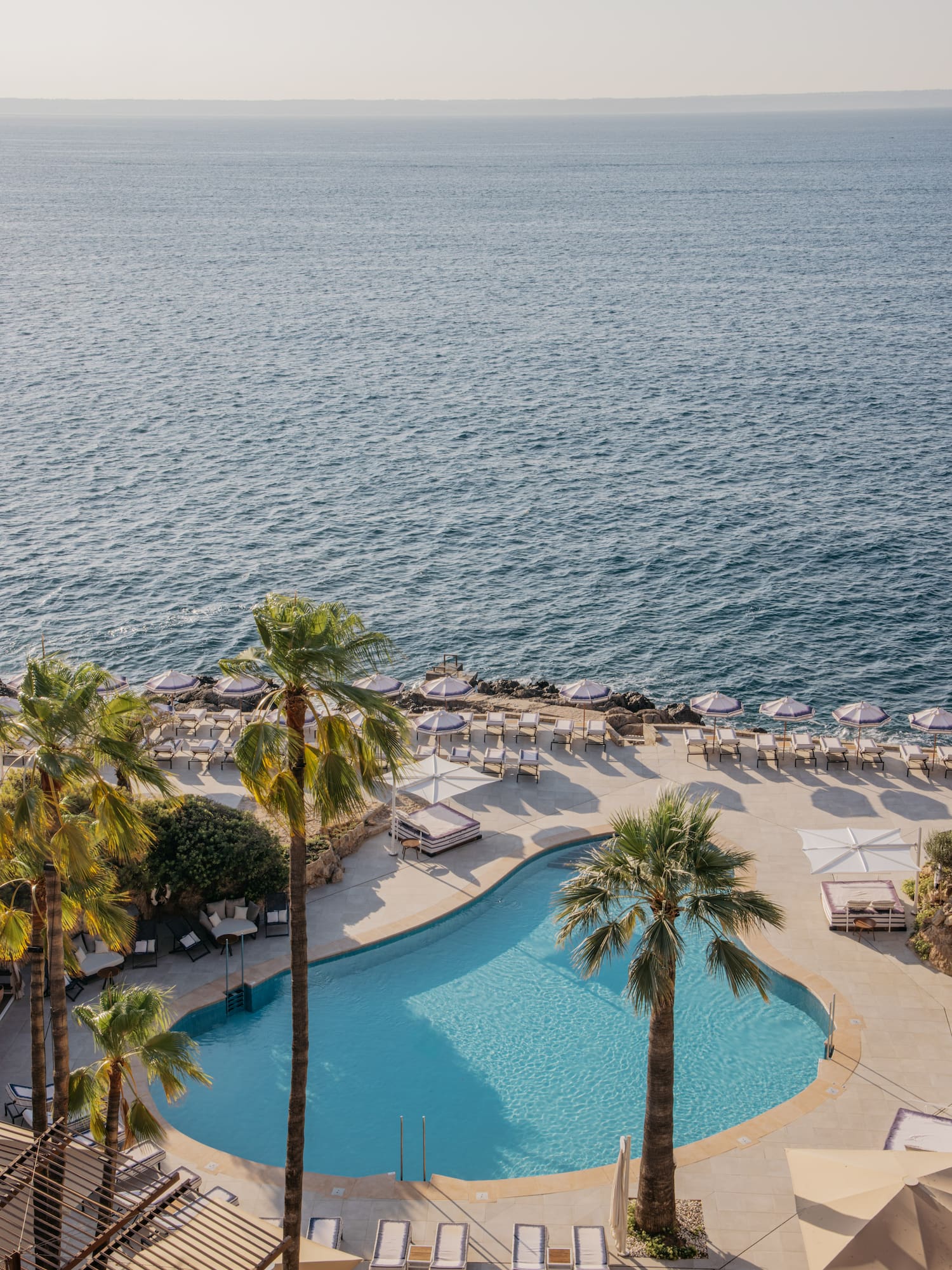 a pool next to a body of water