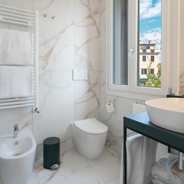 a bathroom with a sink and toilet