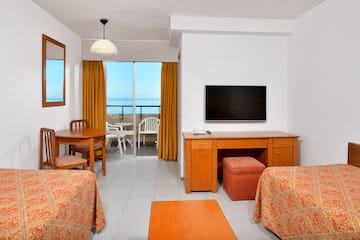 a room with a television and table