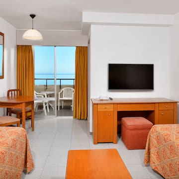 a room with a television and table