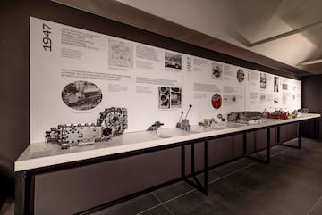 a display of mechanical parts on a white surface