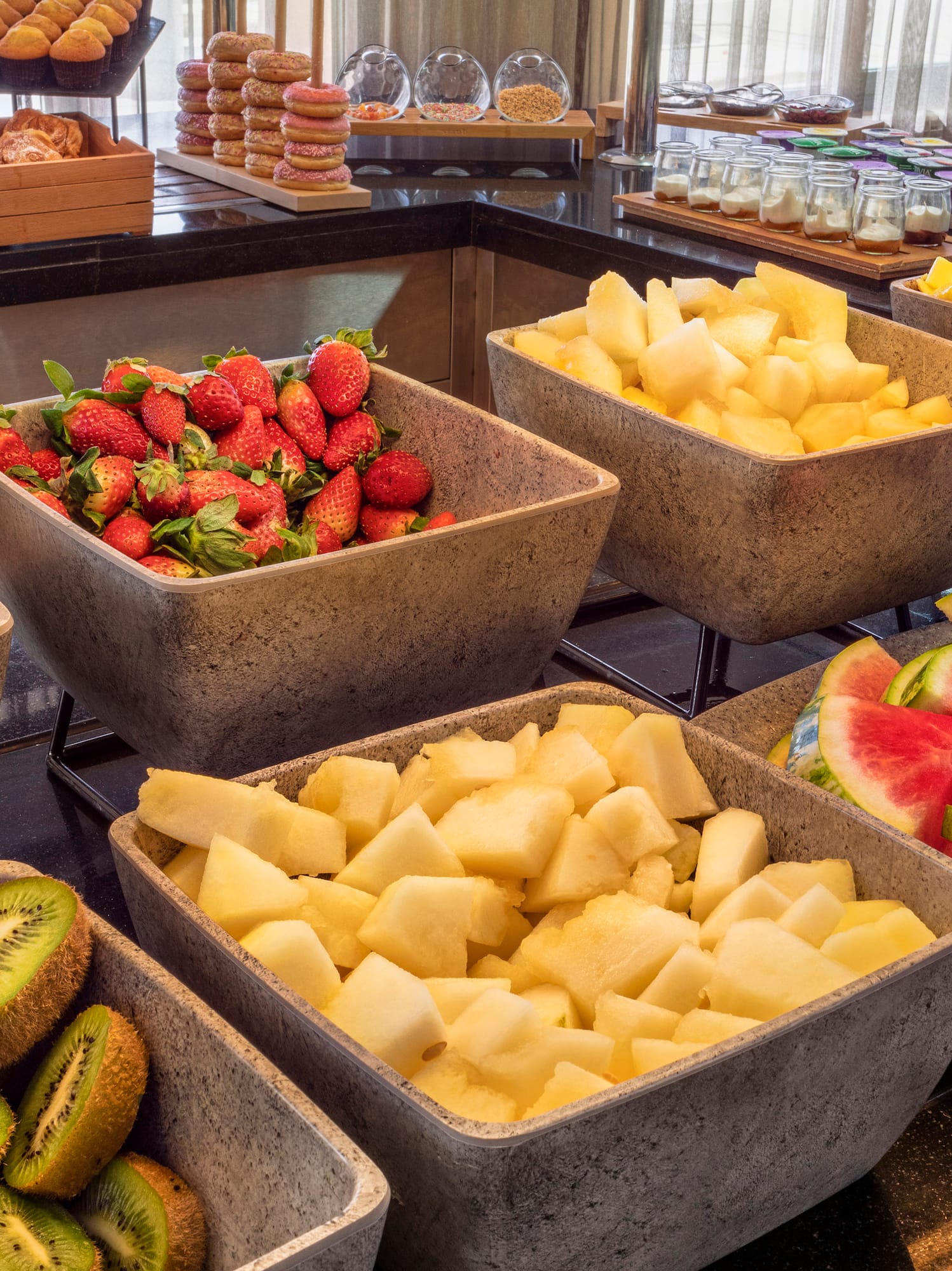 a group of bowls of fruit