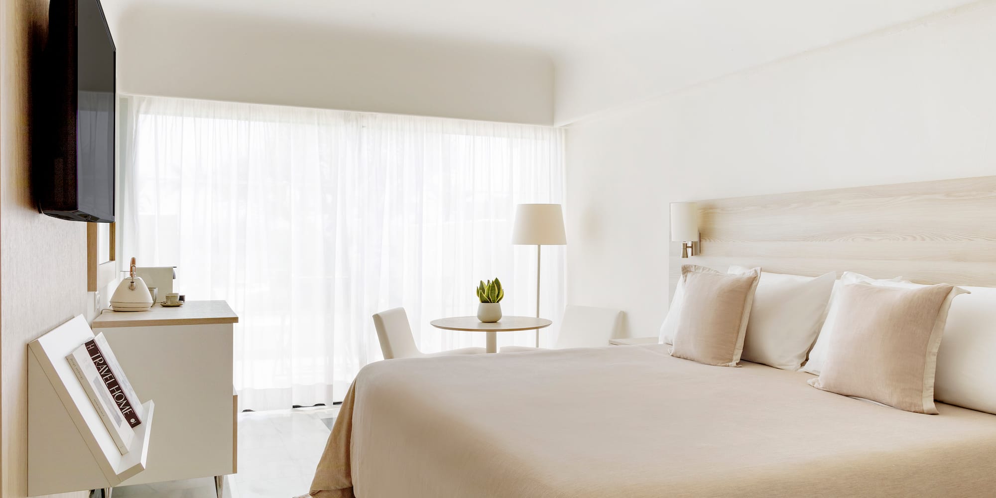 a bedroom with a bed and a table