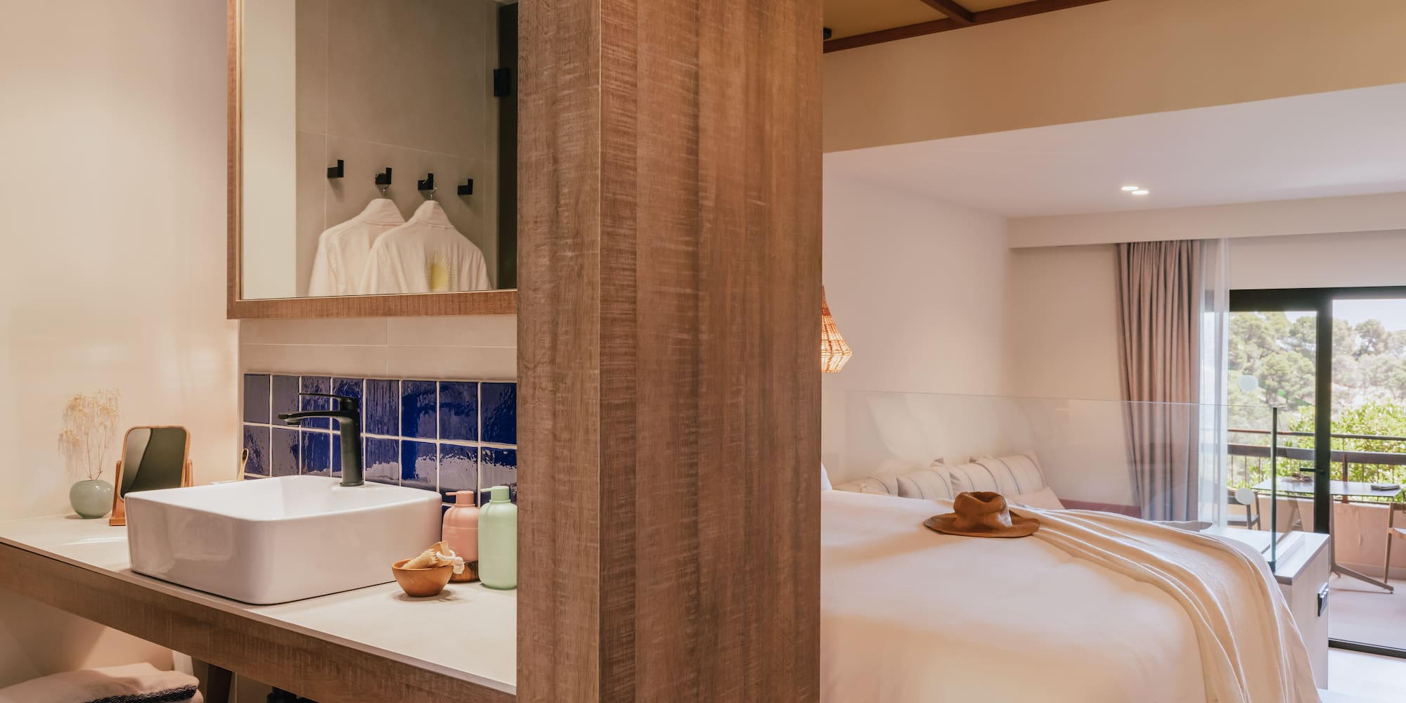 a room with a bed and sink