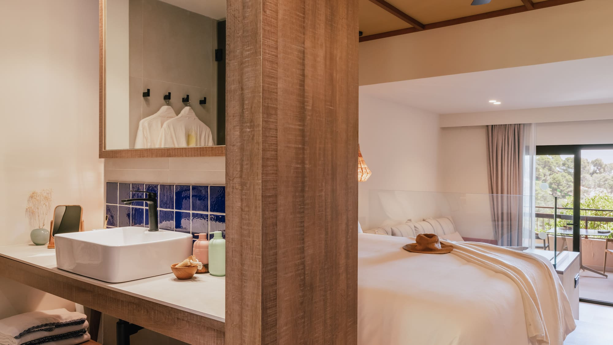 a room with a bed and sink