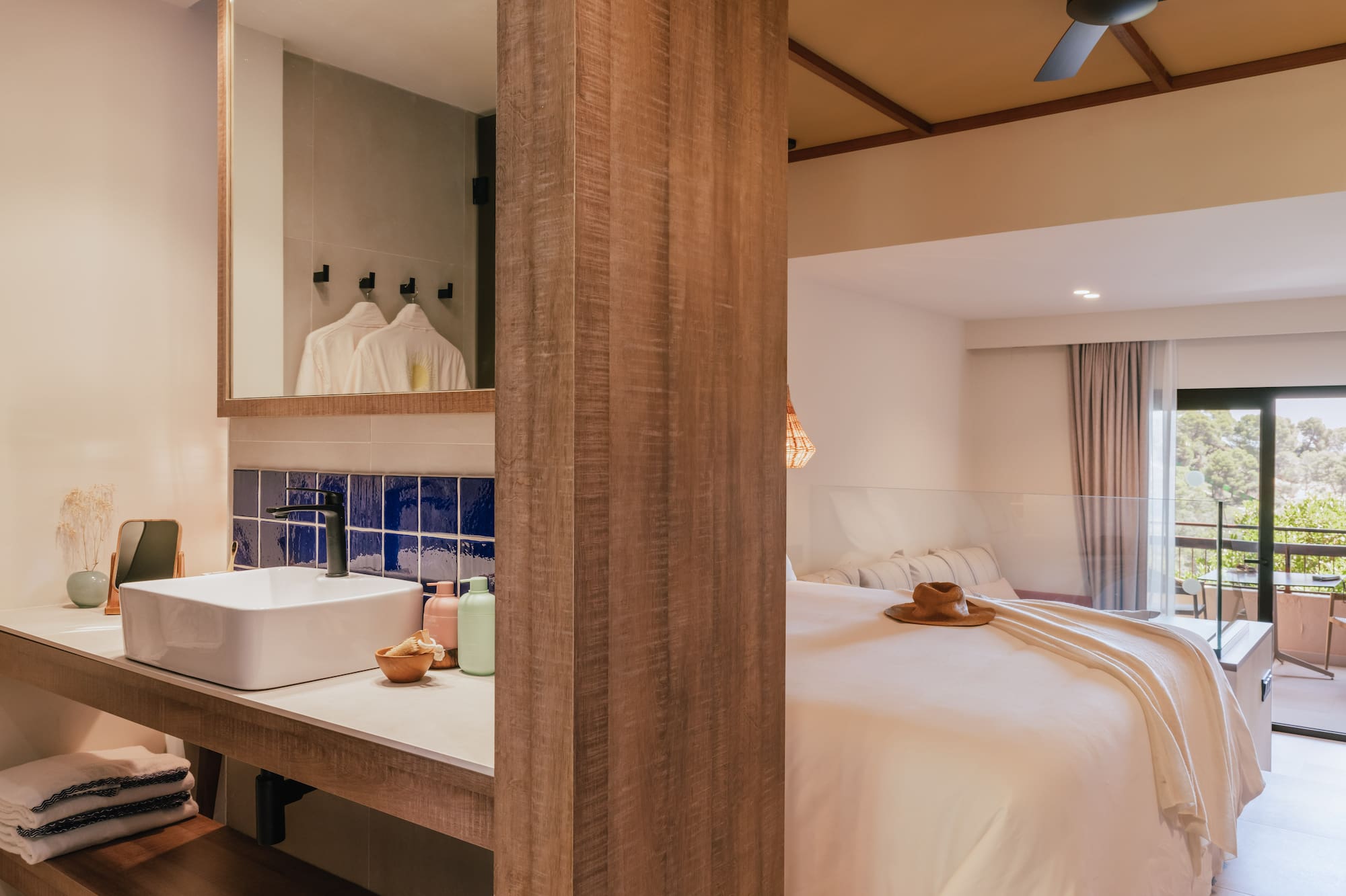 a room with a bed and sink