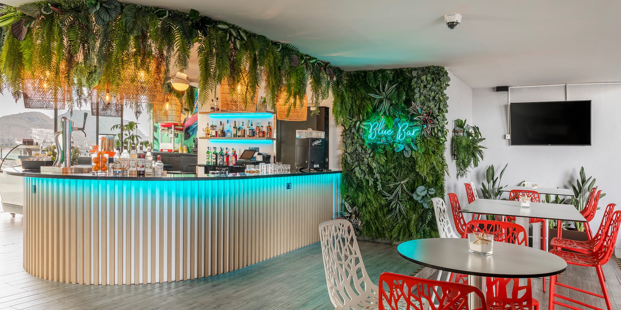 a bar with tables and chairs