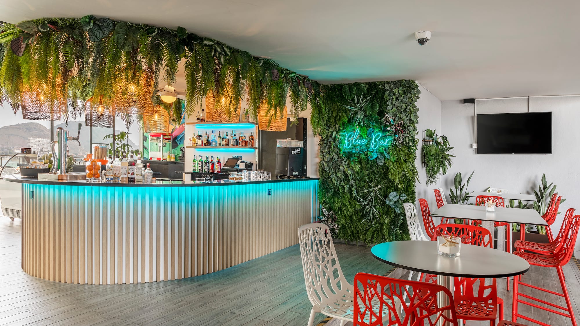 a bar with tables and chairs