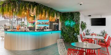 a bar with tables and chairs