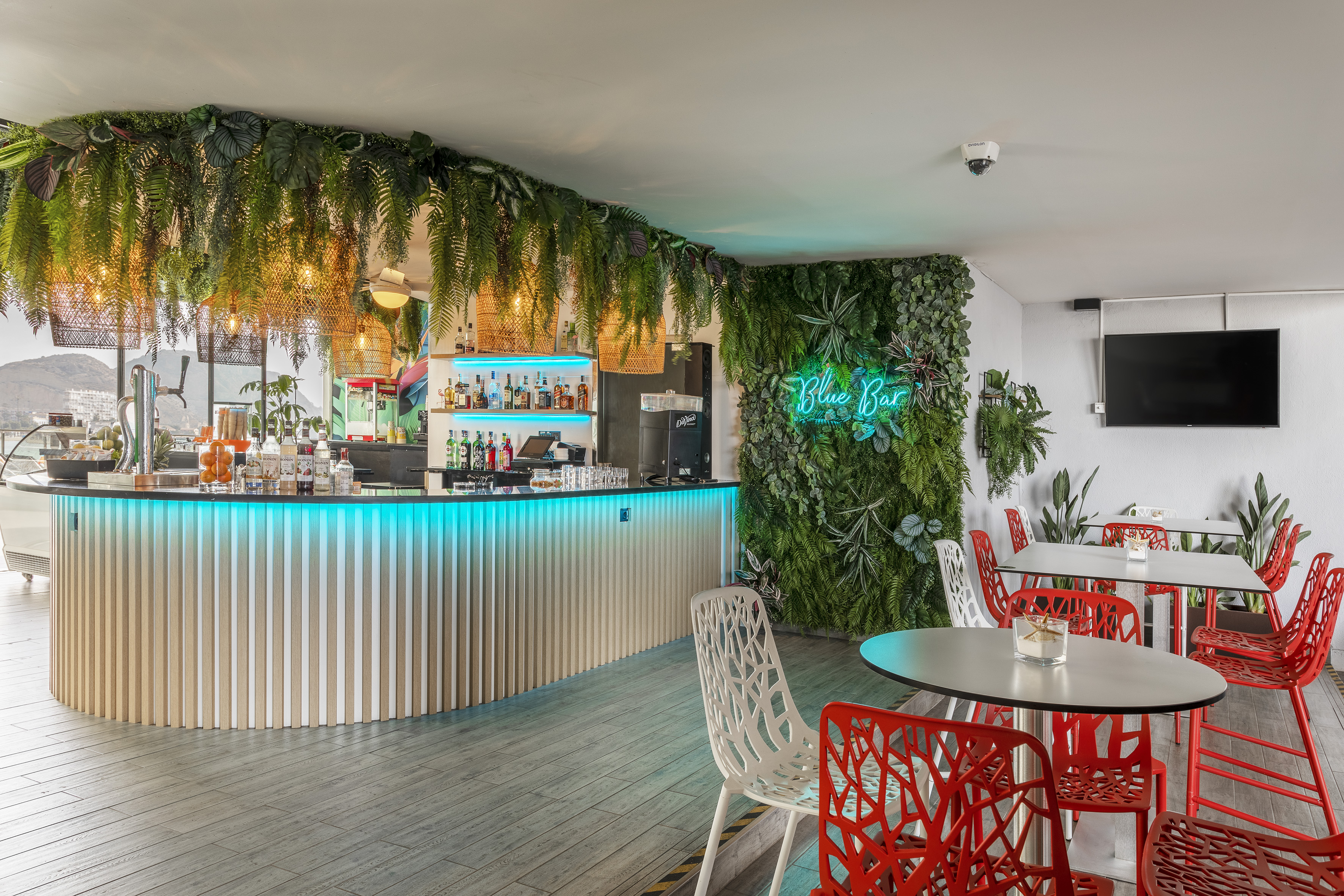 a bar with tables and chairs