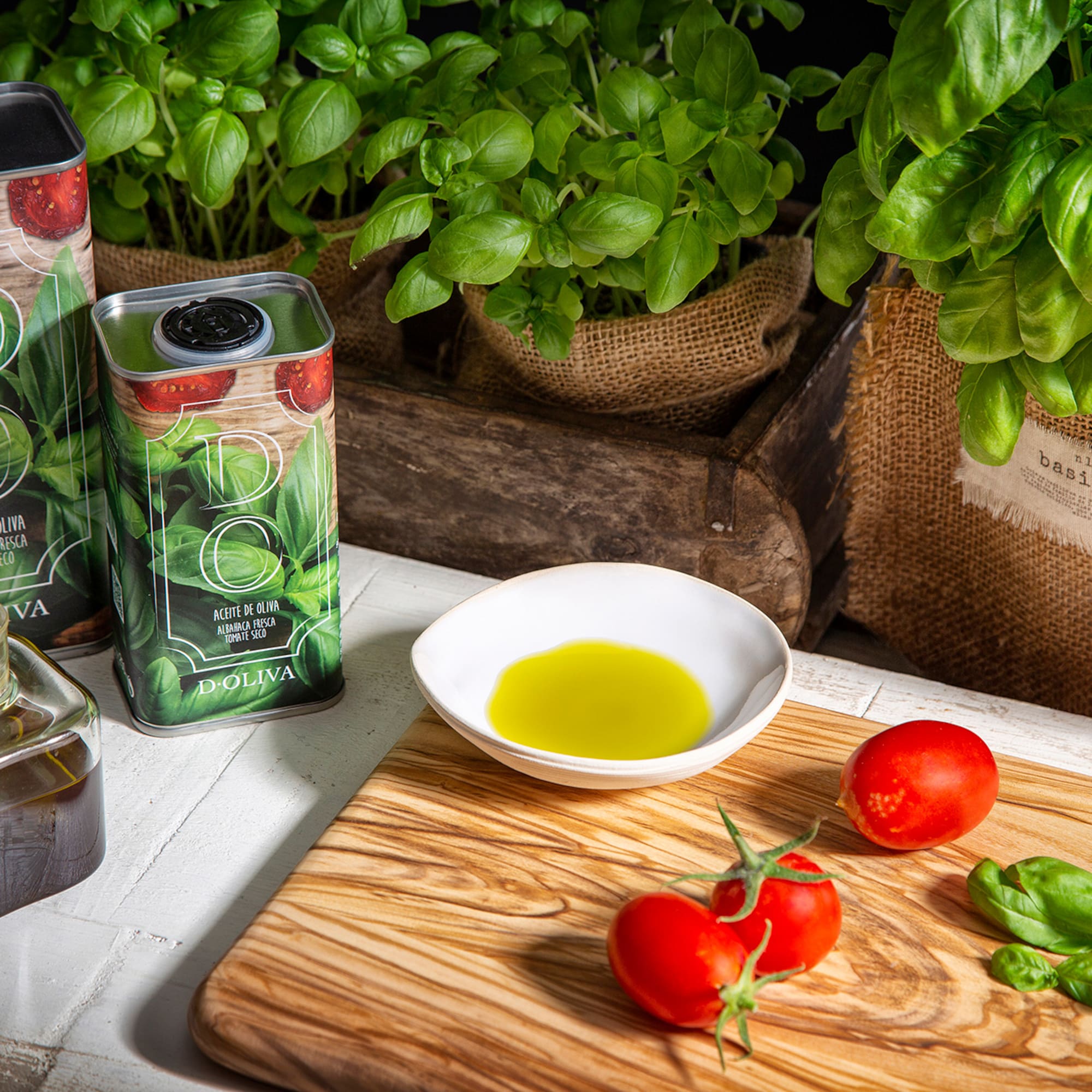 tomatoes and olive oil on a cutting board