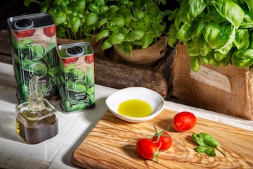 tomatoes and olive oil on a cutting board