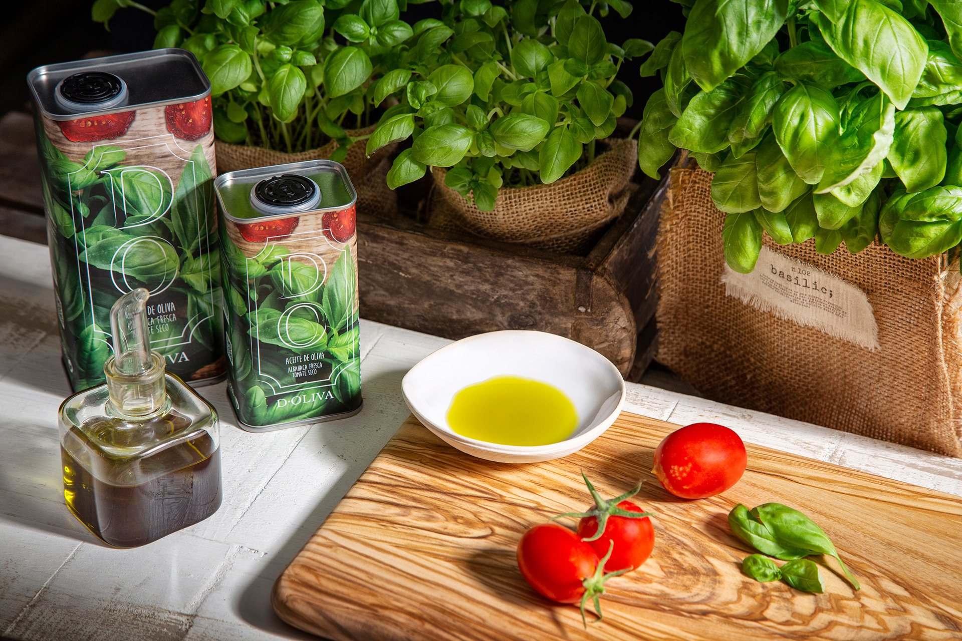 tomatoes and olive oil on a cutting board