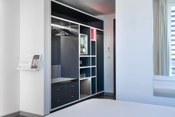 a room with a closet and a bed