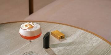 a glass of liquid on a table